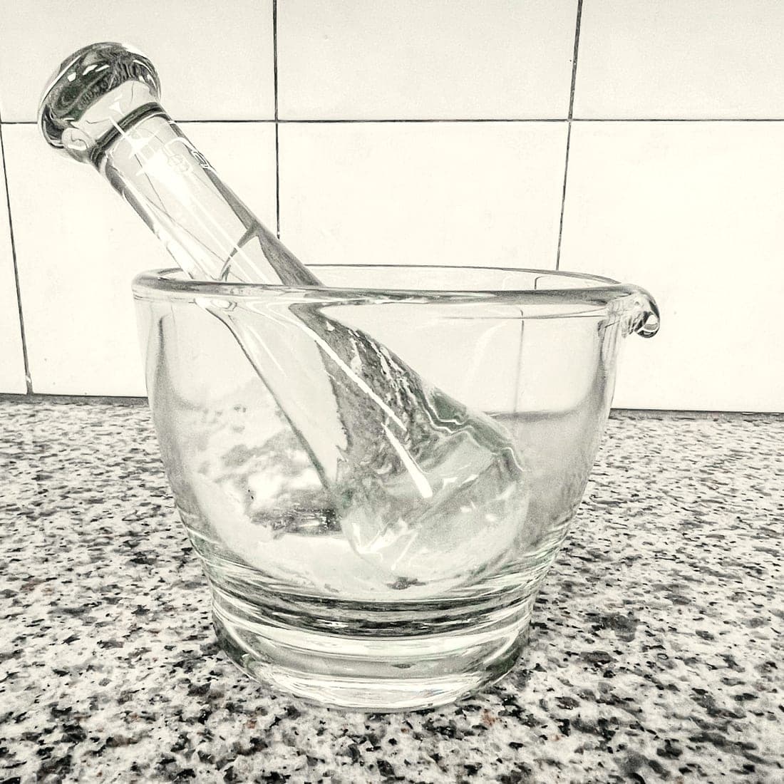 A glass mortar and pestle holding a freshly compounded cream at Craft Pharmacy